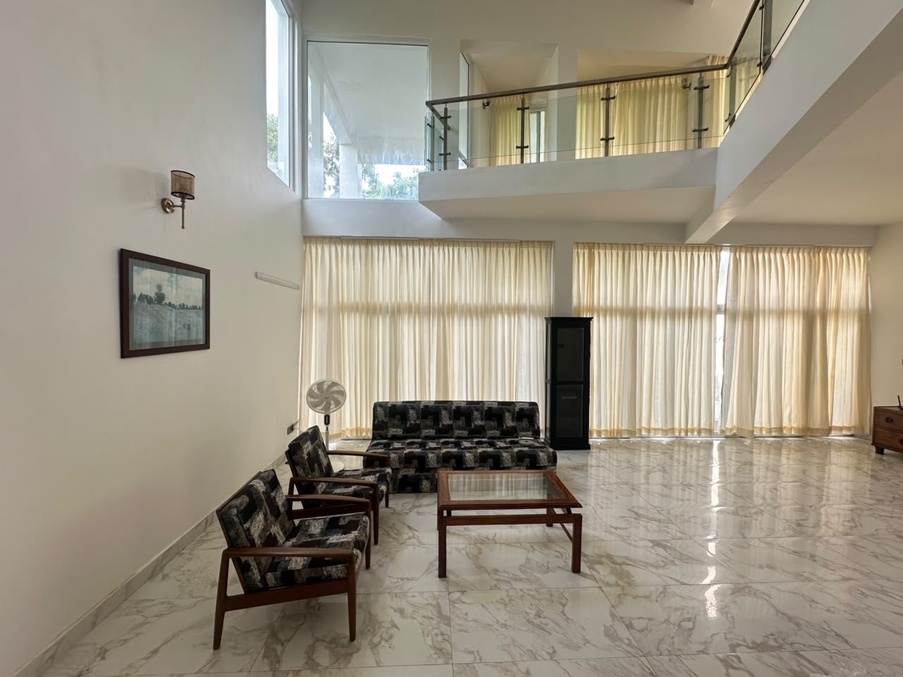 Warm, wood-toned hotel room interior at The Neelapod
